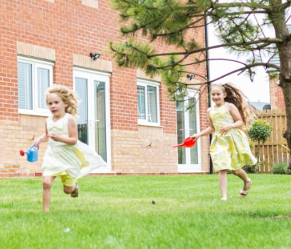 girls running in garden